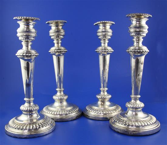 A set of four George III silver candlesticks by J.T. Younge, Walker & Crowder, weighted.
